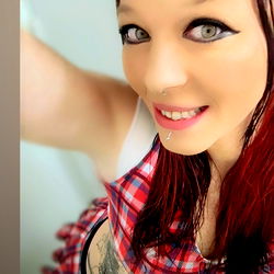 Amberlee Smith, OnlyFans Model - Playful Pose and Red Hair