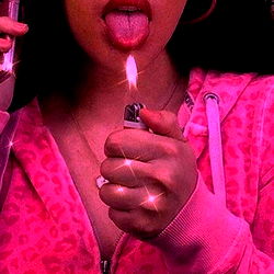 Woman in Pink Pajamas with Lighter and Sparkles