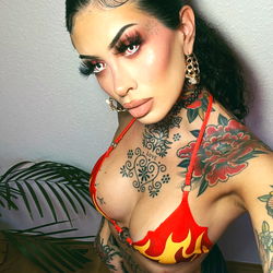 Perrine Nobrega - Vibrant Model Posing with Bold Makeup and Bright Swimwear