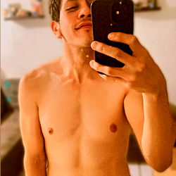 Fitness Model Beto Lara Capturing His Shirtless Mirror Selfie