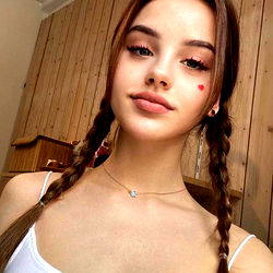 Onlyfans Model Posing for Selfie with Pigtails and Red Lipstick