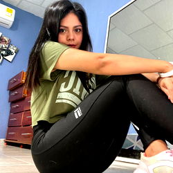 Andrea A, a Model from Colombia - Sitting on the Floor with a Smile