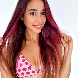 Beautiful Alina Flexy, a Ukrainian OnlyFans Model with Long Pink Hair and Red Tattoos