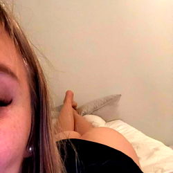 Smiling Woman Relaxing in Bed