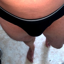 Fit Older Man in Bikini on Floor