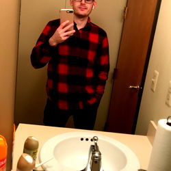 Turtlesxrawr, a Michigan-based model, strikes a pose in bathroom mirror