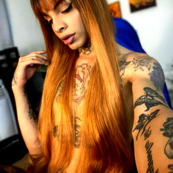 Onlyfans Model Vero G Posing for Selfie with Tattoos and Long Hair