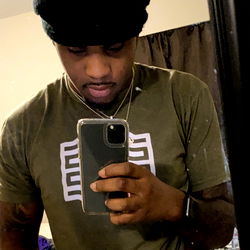 Man with Black Hoodie and Tattoo Taking a Selfie