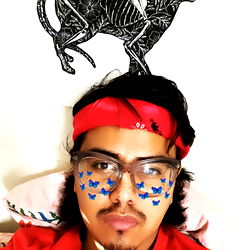 A Casually Dressed Person with Headband, Sunglasses and Tattoo