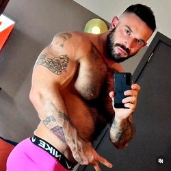 Bodybuilder Bo Showcases His Muscular Physique in Gym