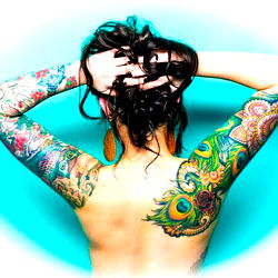 Sugaboots Tattooed Model on Turquoise Background