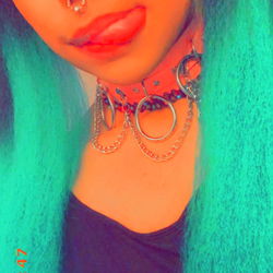 Vivid Vixen with Turquoise Tresses and Red Accents