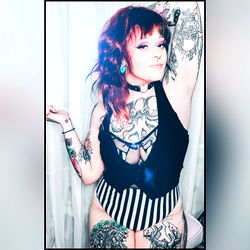 Tattooed Female Model in Garter and Lace