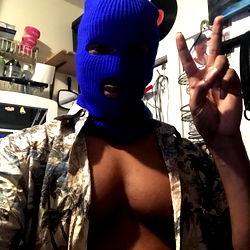 Man in Mask Taking Selfie