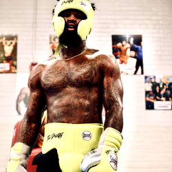 Boxing Heavyweight Contender Montana Love Strikes Pose with Gloved Fists
