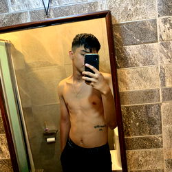 Shirtless Man in Bathroom Mirror