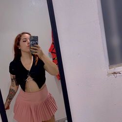 OnlyFans Model PASTELITO in Pink Skirt and Black Tank Top