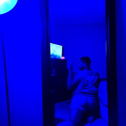 Throat Baby from Houston, Texas in a vibrant blue room