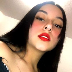 Anahyy, a striking model with bold red lipstick