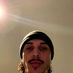 Athletic Young Man in Hoodie and Hat