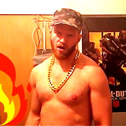 Angryaccent | A Shirtless Man with a Chain and Flame
