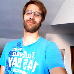 Dorf Lümmel in a blue t-shirt