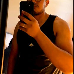 Fashion-forward Junior in a casual pose with a phone