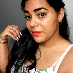 Anais Trutie, OnlyFans Model, Showcasing an Instagram-style post with a confident expression and a casual pose. The background suggests a home setting.