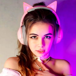 Model's Elegant Pose in Gaming-themed Photoshoot