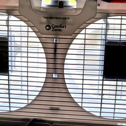 Model in a Hot Room with an Air Conditioning Unit