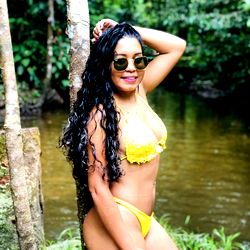 Larissa Lima in a yellow bikini at the beach