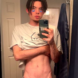 Shirtless Man in Bathroom Mirror with Phone