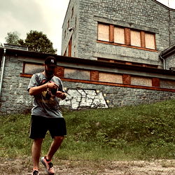 A Person Walking Away from a Brick Building