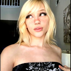 Lexi, a Striking Blonde Model with Eye-catching Eyeshadow and an Exotic Tattoo on Her Arm