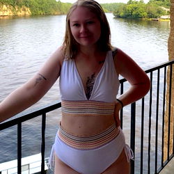 Sexy blonde in swimwear by river