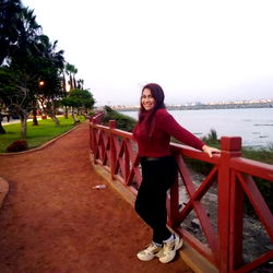 Enjoying a serene moment by the water at sunset