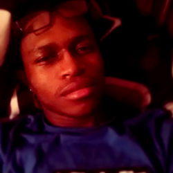 A man resting with glasses on, in a room