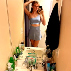 Xena, a model from the USA, in her bathroom mirror