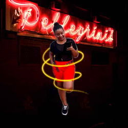 Onlyfans model photographed in a neon-lit urban setting