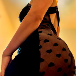 Sensual MysteryCouple Posing in a Black Dress