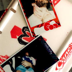 Four Polaroids and a Coca-Cola Card with Personal Items