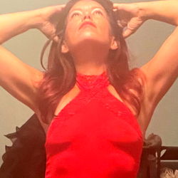 Jackie, the Nashville-based OnlyFans model in a red dress