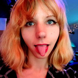 Lively Blonde Model Posing for the Camera with a Playful Expression