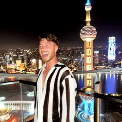 A Man Posing for a Selfie at Night