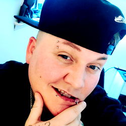 Jayyson's Playful Pose with Pierced Nose and Blue Cap