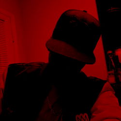 Atlanta-based model, NoTapOut Experience, posing for the camera with a moody backdrop