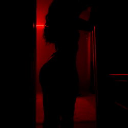 Erotic OnlyFans Model in Dark Room