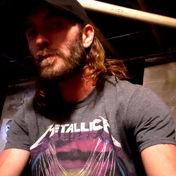 Bearded Man in Black Hat with Mustache