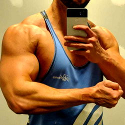 BigKyle Fitness Model Sharing Workout Routine in Gym Mirror Photo