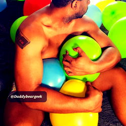 Candid Moment of Daddy Bear Geek with Balloons